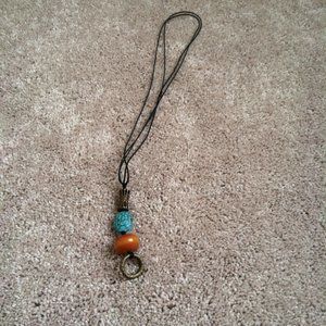 Turquoise, amber, and bronze ring pendant